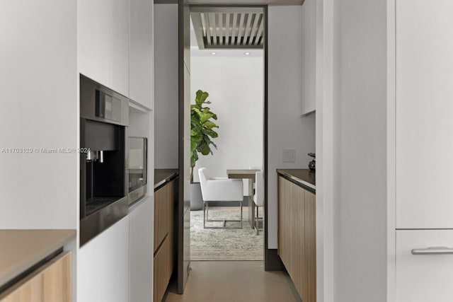 kitchen featuring white cabinetry