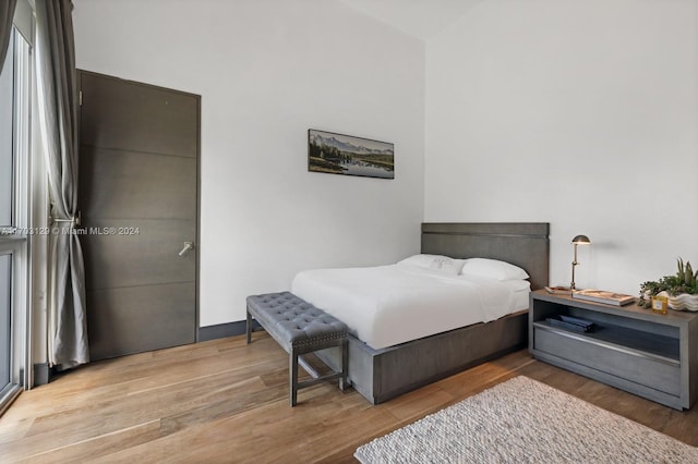 bedroom featuring wood-type flooring