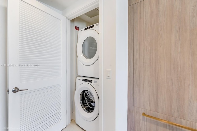 washroom with stacked washer / drying machine