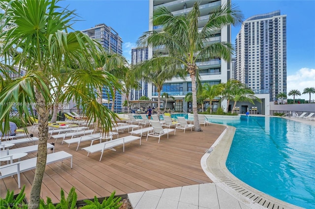 view of swimming pool with a deck