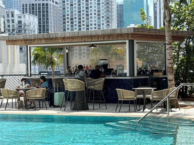 view of pool with ceiling fan