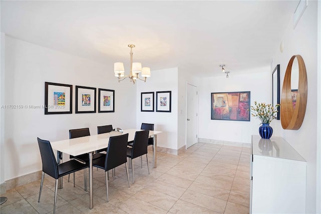 dining area featuring a chandelier