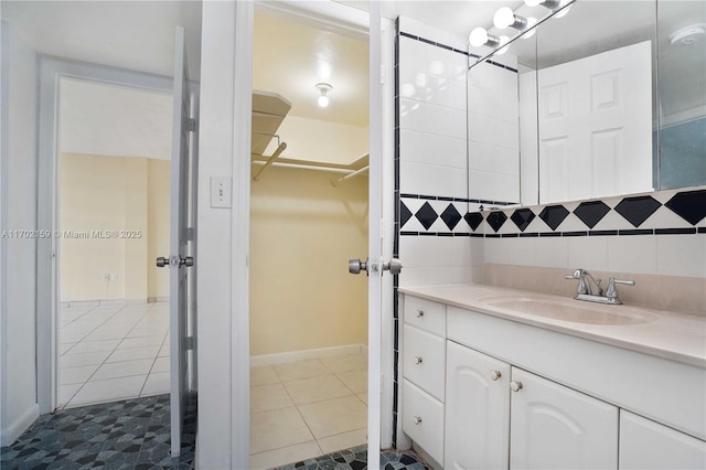 bathroom with tile patterned flooring and vanity