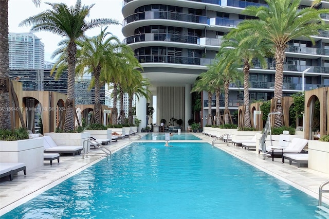 view of swimming pool featuring a patio area