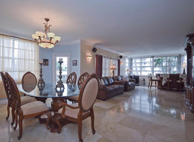 dining room featuring crown molding and a chandelier