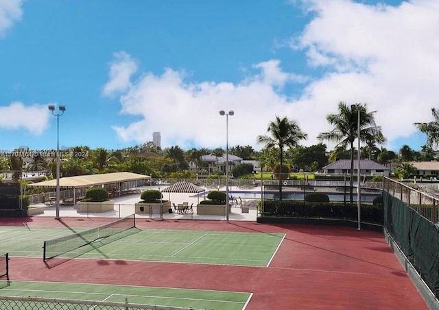 view of sport court featuring basketball hoop