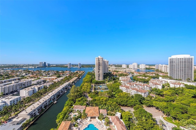 drone / aerial view featuring a water view and a view of city