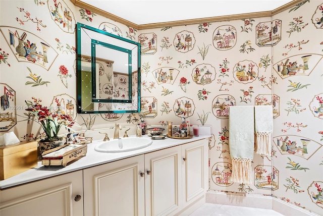 bathroom with tile patterned flooring, vanity, and crown molding