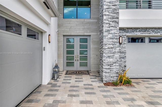 property entrance featuring french doors