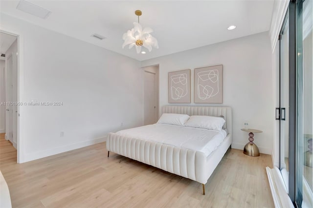 bedroom with a closet and light hardwood / wood-style flooring