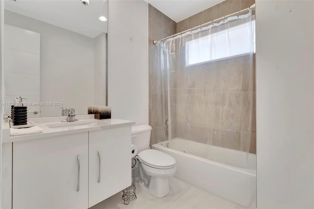 full bathroom with tile patterned floors, shower / tub combo with curtain, vanity, and toilet