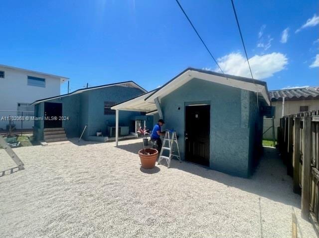 rear view of property featuring a patio