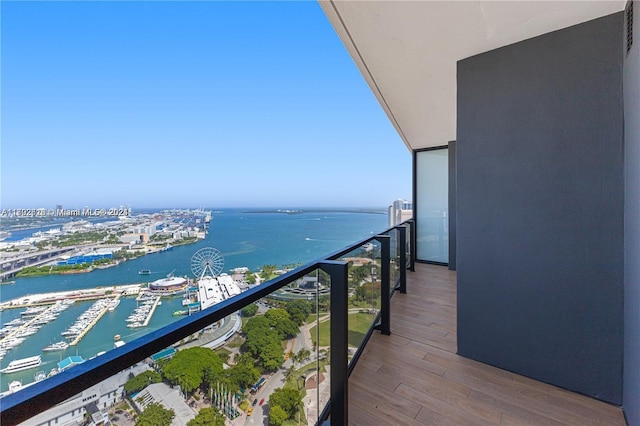 balcony featuring a water view