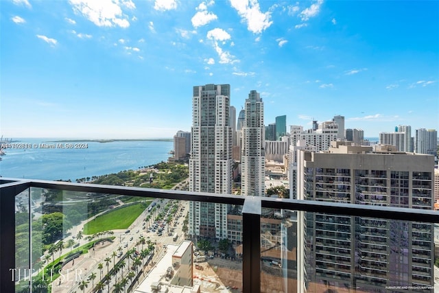 balcony featuring a water view