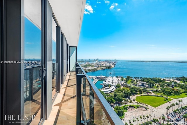 balcony featuring a water view