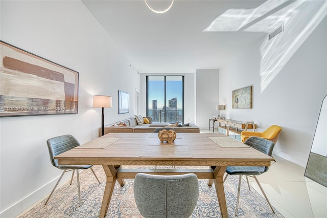 dining space featuring tile patterned floors