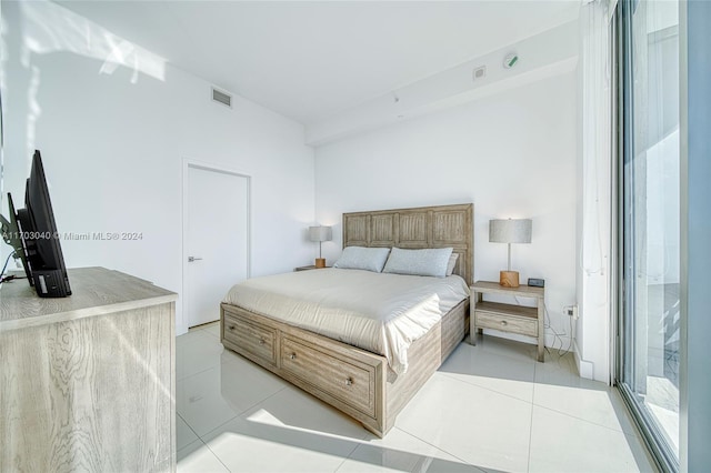 bedroom featuring light tile patterned floors