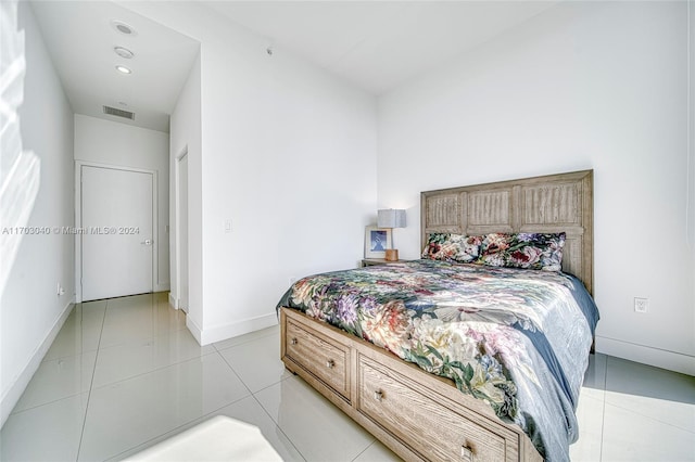 bedroom with light tile patterned floors