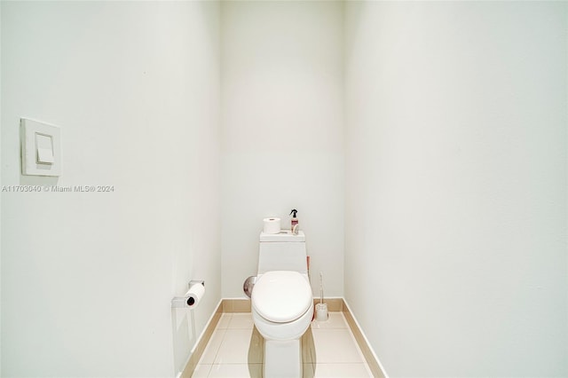 bathroom featuring tile patterned flooring and toilet