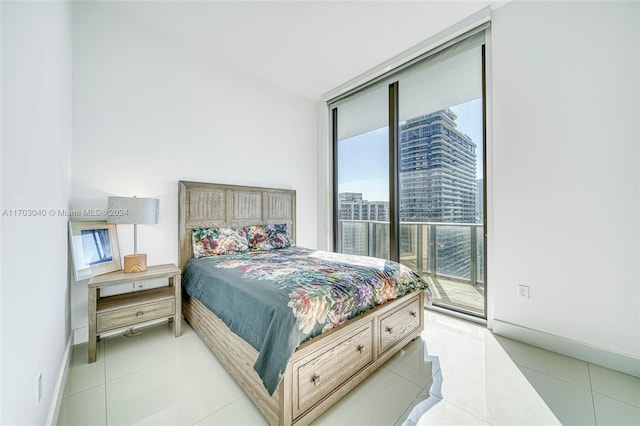 bedroom with light tile patterned flooring, access to outside, and multiple windows