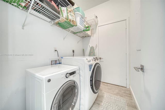 washroom featuring light hardwood / wood-style flooring and independent washer and dryer