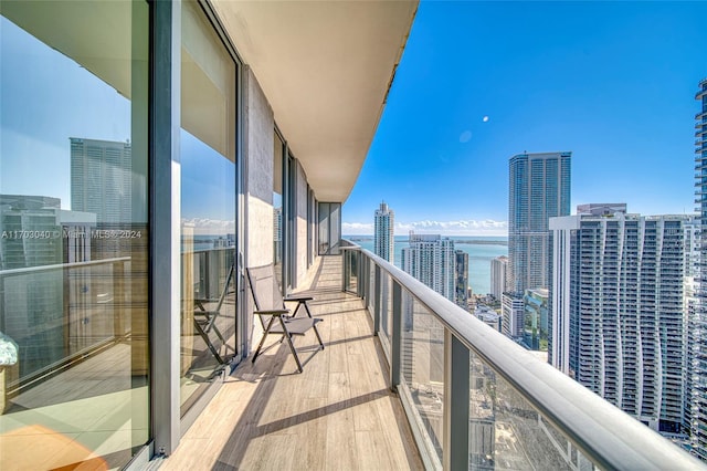 balcony featuring a water view