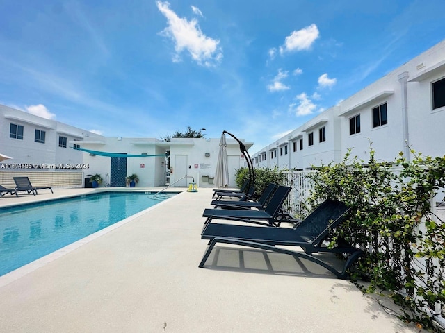 view of swimming pool featuring a patio area