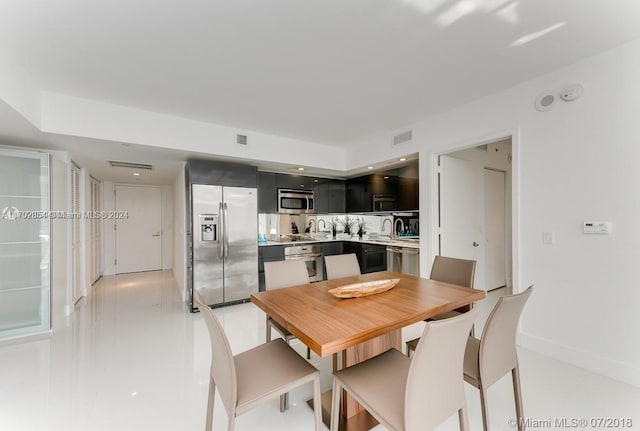 dining space with sink