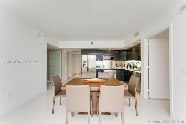 tiled dining area with sink