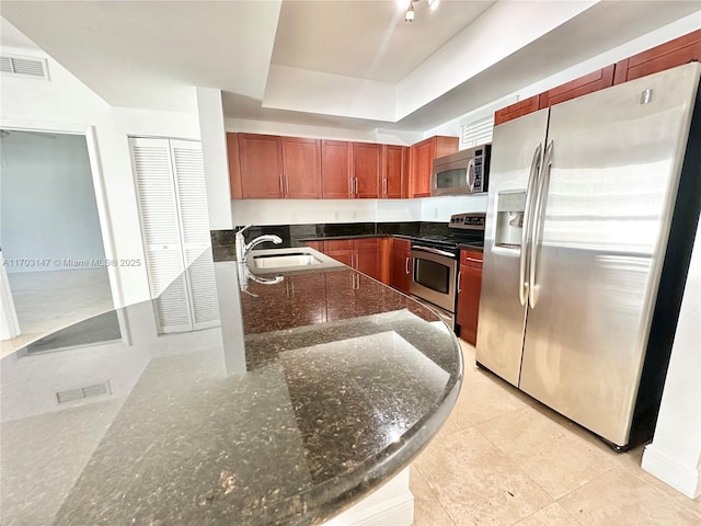 kitchen with sink, light tile patterned floors, and stainless steel appliances