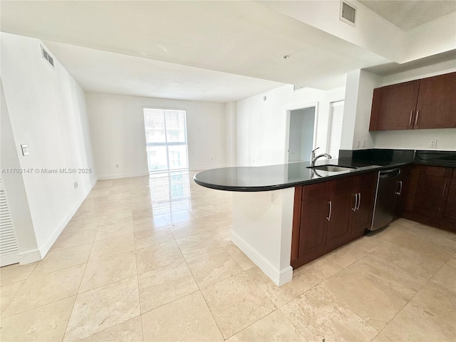 kitchen with dishwasher, a kitchen breakfast bar, kitchen peninsula, sink, and dark brown cabinetry