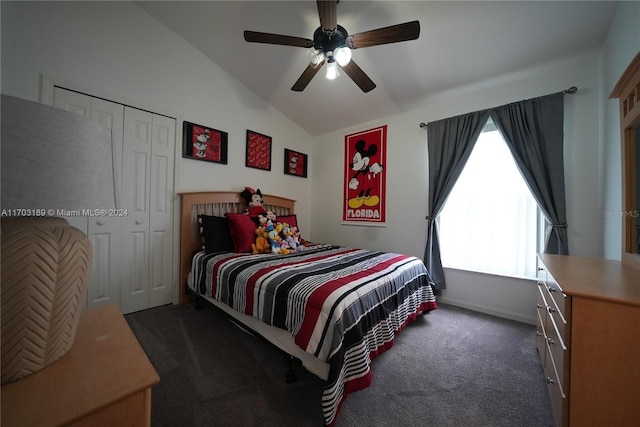 carpeted bedroom featuring ceiling fan, a closet, and lofted ceiling