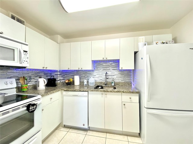 kitchen featuring white cabinets, backsplash, white appliances, and sink