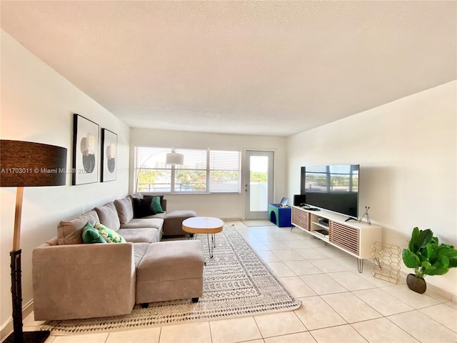 tiled living room with a textured ceiling