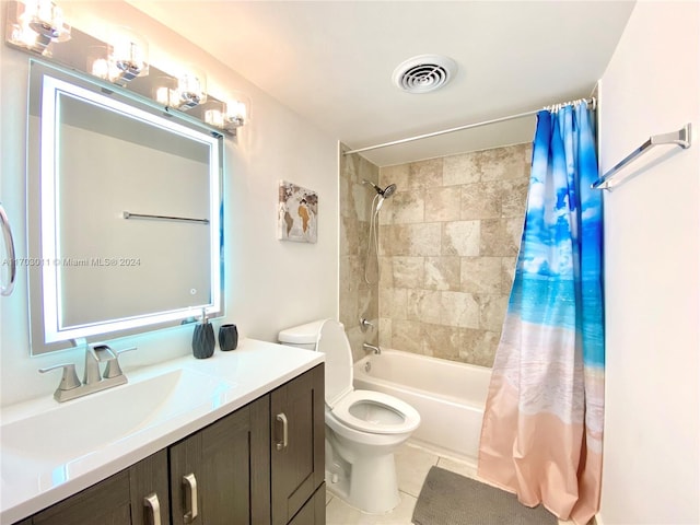 full bathroom featuring tile patterned flooring, shower / bath combo, toilet, and vanity