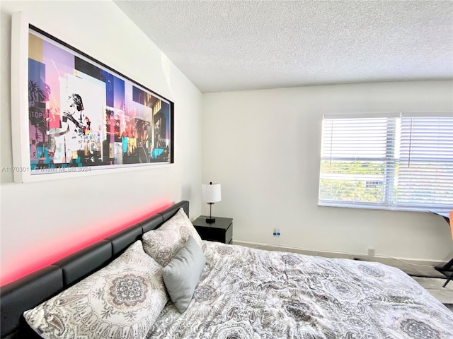 bedroom featuring a textured ceiling