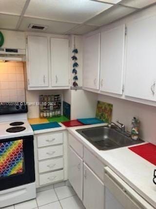 kitchen featuring dishwasher, white cabinetry, white electric stove, and sink