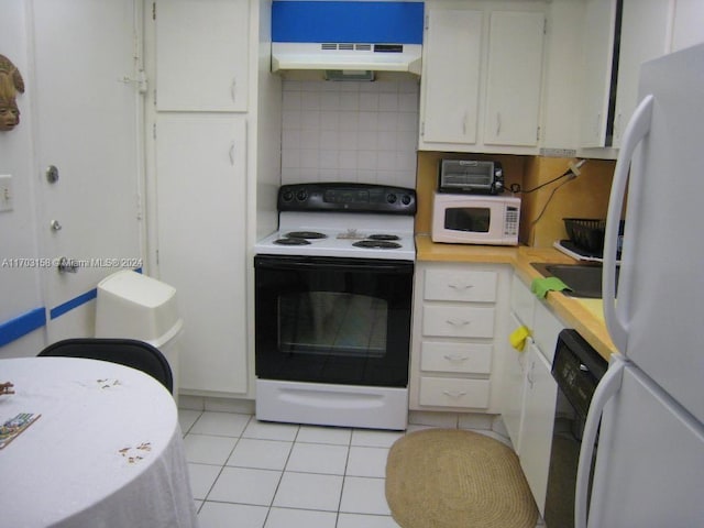 kitchen featuring white appliances, ventilation hood, white cabinets, tasteful backsplash, and light tile patterned flooring