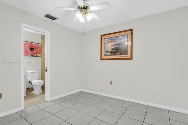 interior space with ceiling fan and light tile patterned flooring