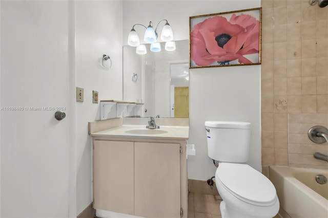 full bathroom featuring tiled shower / bath, tile patterned flooring, vanity, and toilet