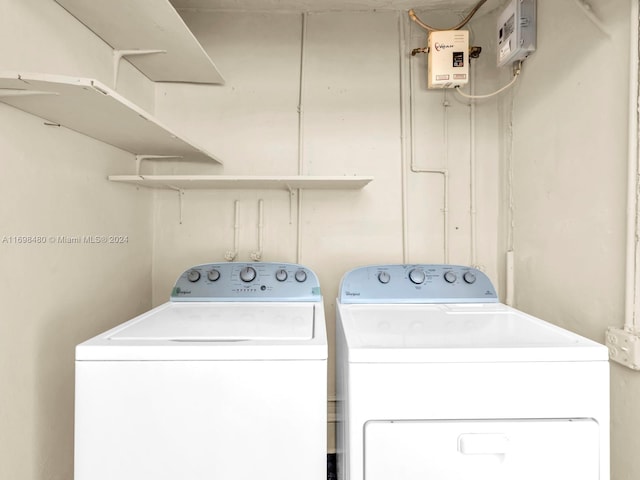 washroom with washer and dryer