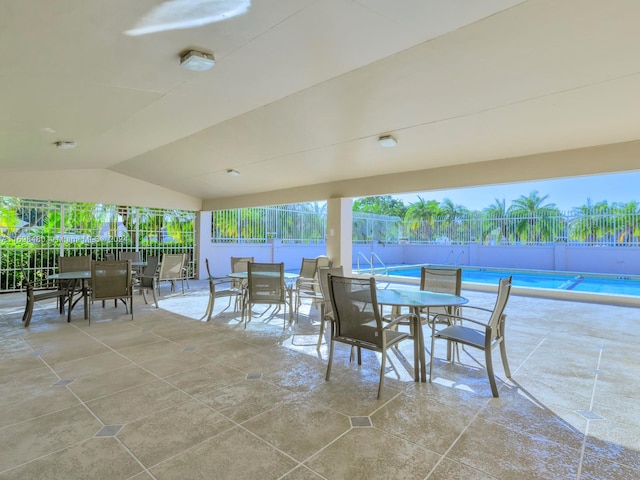 view of patio with a fenced in pool