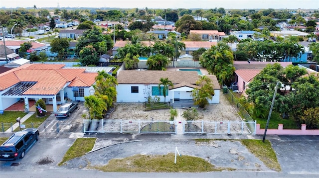 birds eye view of property with a residential view