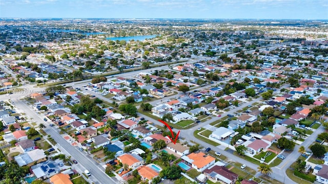 birds eye view of property featuring a residential view and a water view