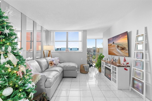 living room with light tile patterned floors and a textured ceiling