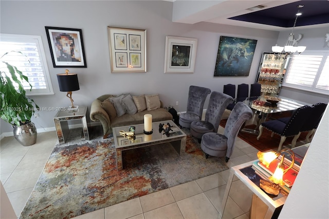 8778 SW 222nd Ter, Cutler Bay, FL 33190 - tiled living room with a chandelier, healthy amount of natural light, and baseboards