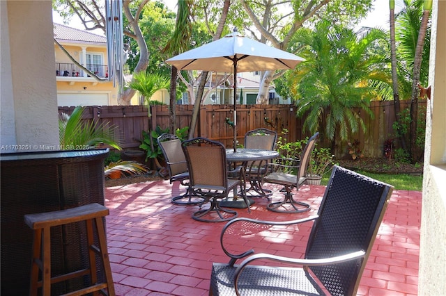 view of patio / terrace featuring a fenced backyard and outdoor dining area