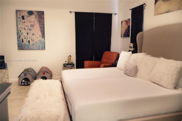 tiled bedroom with baseboards