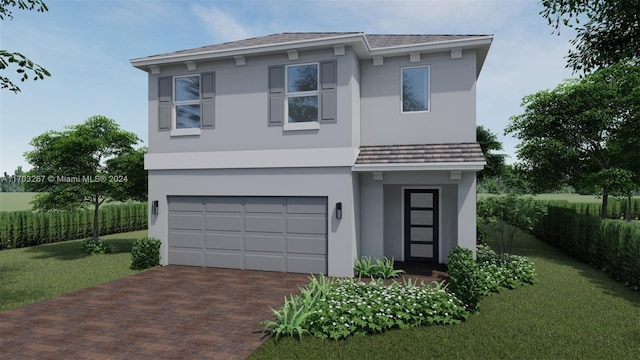 view of front of home with a garage and a front lawn