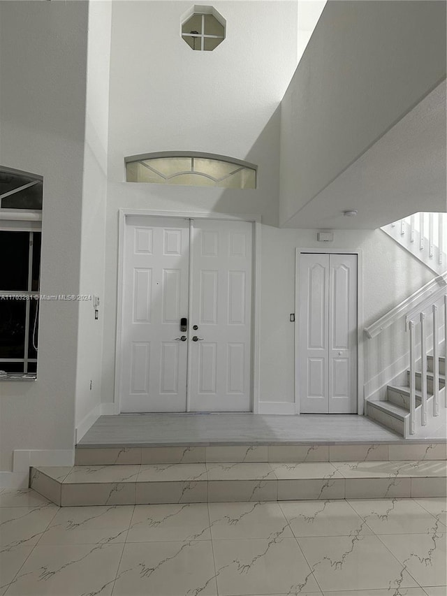 entrance foyer featuring a high ceiling